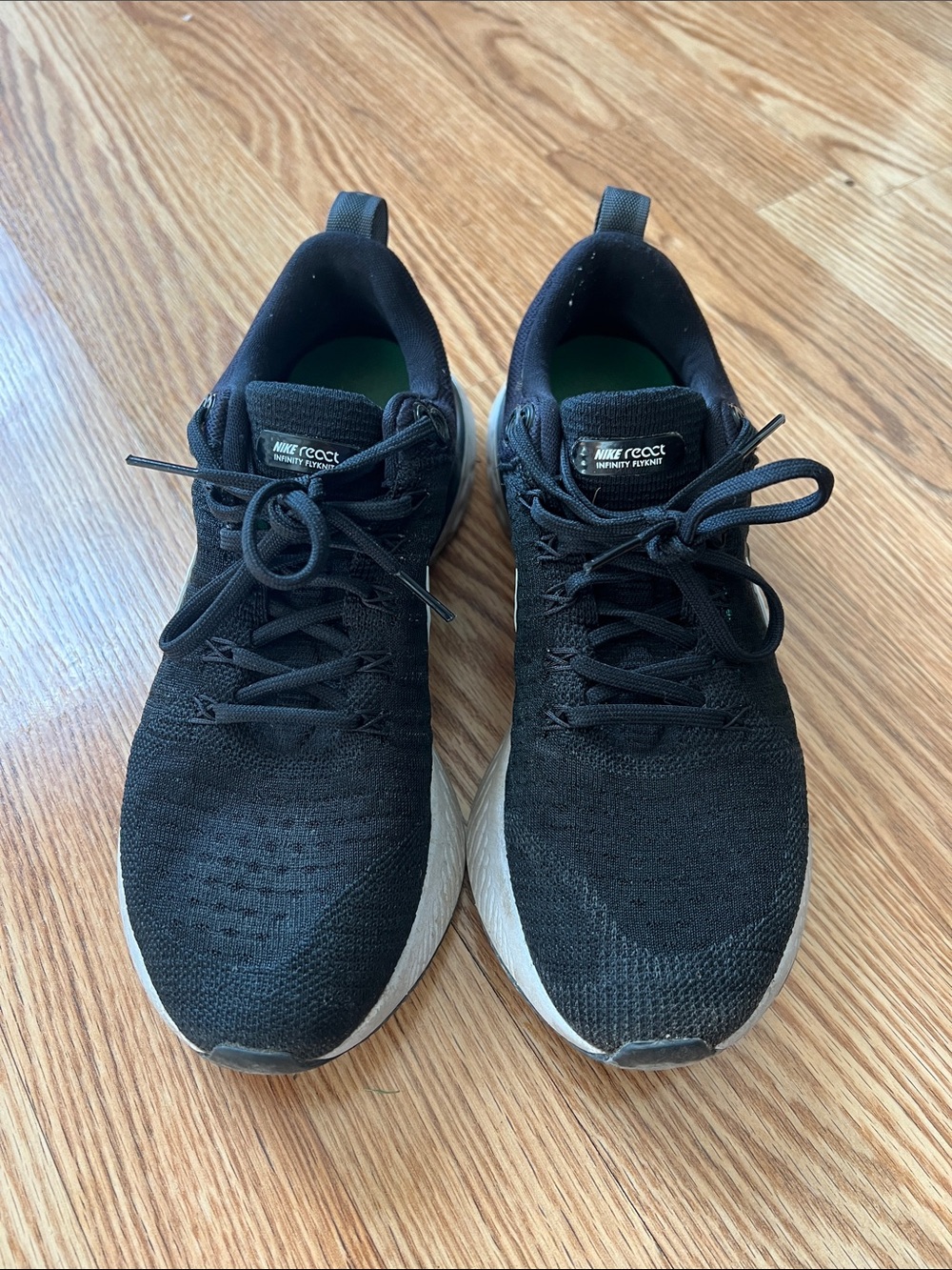 Nike women’s Black Knit Athletic Shoes with White Midsole